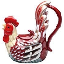 a red and white rooster figurine sitting on top of a table