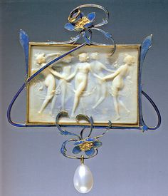 an art piece with blue and white designs on the front, hanging from a chain