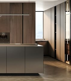 a modern kitchen with wood paneling and stainless steel counter tops, along with an island in the middle