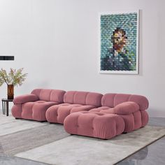 a living room with a large pink couch