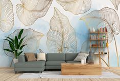 a living room with a couch, coffee table and wall mural