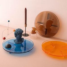 there are three different objects on the table and one has a blue busturine