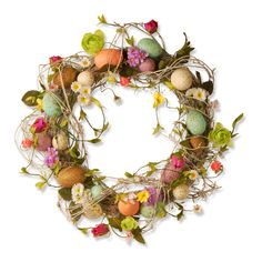 an easter wreath with flowers and eggs