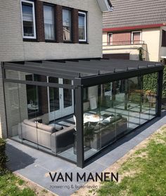 an image of a modern house with glass walls