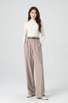 With its timeless silhouette and luxurious feel, this womens bespoke high waist wide leg wool pants is a true investment piece that will elevate any outfit to new levels of refinement and class. DETAIL * 30% wool, 30% fiber, 40% polyester * Fully satiny lining, more nice to the touch body * Two side seam pockets * Front button and zipper closure * Maxi wool pants * Wide leg wool pants * Loose wool pants * Daily casual pants * For autumn and winter * Dry clean * Belt not for sale * Lean More about the items From the FAQs on the page bottom MODEL SIZE Bust 85 cm(33.4") Waist 67 cm(26.7") Height 168cm (5' 6") She wears size XS Choose CUSTOM Order if you * Need a better fit * Can't find your size in our size Chart * Change the Style * Chang the Length * Your Height is not Between 5'1" - 5"9" * High Waist Loose Pants Outfit, Wide Leg High Waist Pants Outfit, Wool Wide Leg Pants, Wide Leg Trousers Outfit Fall, Wide Leg Trousers Outfit, Custom Pants, Loose Pants Outfit, Pants Custom, High Waisted Pants Outfit