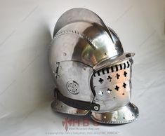 Description :  HBC Armor's Hand Forged Medieval Landsknecht Burgonet Helmet with Interchangeable Visors is designed for individuals who value authenticity, history, and adaptability in their armor. It's a symbol of passion, innovation, and unwavering dedication. Elevate your historical reenactments and immerse yourself in the XVI Century with the Hand Forged Medieval Landsknecht Burgonet Helmet  What sets this remarkable helmet apart is its innovative design featuring three interchangeable visors. Adapt to the demands of battle, reenactment, or personal style with unprecedented ease and versatility. 🏰 FEATURES :  ⦿ Masterful Craftsmanship: Each Landsknecht Burgonet Helmet is a masterpiece born from the meticulous craftsmanship of our dedicated blacksmiths. The hand-forged steel forms a st Burgonet Helmet, Helmet Medieval, Armor Hand, Medieval Reenactment, Medieval Fair, Historical Reenactment, Stage Show, Perfect Foundation, Forged Steel