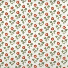 an orange and green flower pattern on white fabric with red flowers in the center,