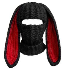 a knitted hat with ears on the top and red trimmings around it