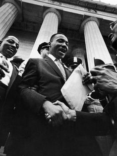 black and white photograph of men shaking hands