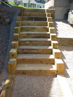 some steps made out of wood in front of a house