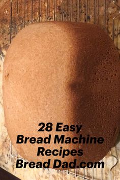 a loaf of bread sitting on top of a counter next to a wire rack with the words 28 easy bread machine recipes