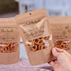 three bags of pretzels sitting on top of a table