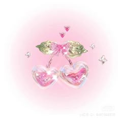 two heart shaped glass figurines sitting next to each other on a pink background