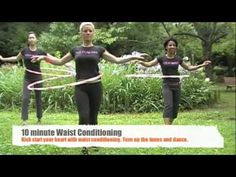 three women in black shirts are playing with hula hoop