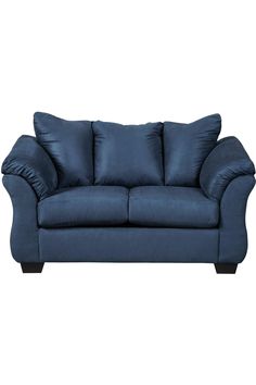 a blue couch with pillows on it