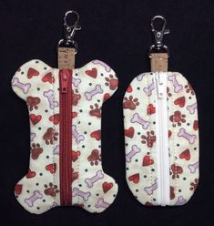 two zippered bags with dogs and hearts on them, one has a red zipper