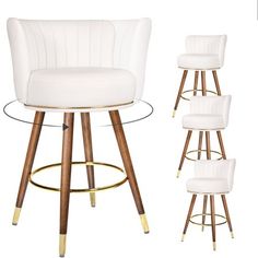 a set of four white bar stools with wooden legs and gold trim around the seat