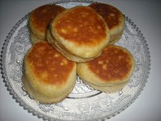 four pancakes sitting on top of a glass plate