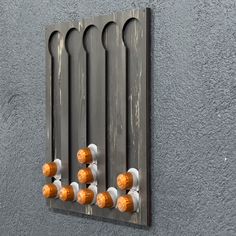 an orange and white wall mounted radiator on the side of a gray building