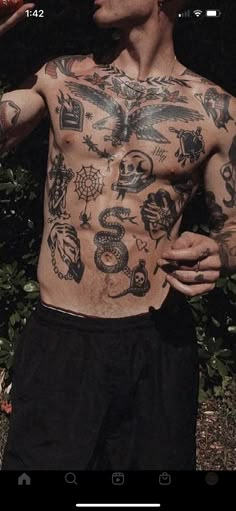 a man with tattoos on his chest holding a baseball bat