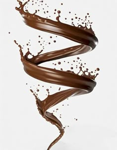 chocolate flowing into the air in front of a white background with splashing liquid on it