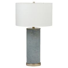 a table lamp with a white shade on it