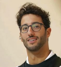 a close up of a person wearing glasses and a shirt with white stripes on it