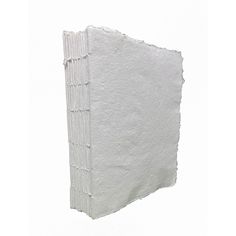 a piece of white paper on a white background