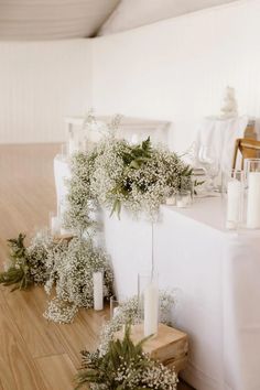 the table is set up with candles and flowers