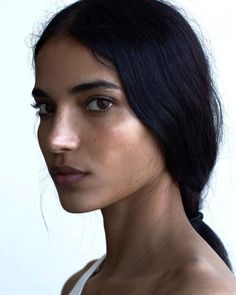 a close up of a woman with black hair