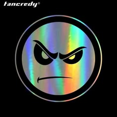 an angry face with eyes in the middle of a circular sticker on a black background