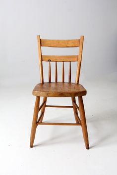 an old wooden chair against a white background