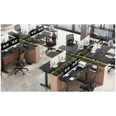 an office cubicle with desks, chairs and plants in the middle of it