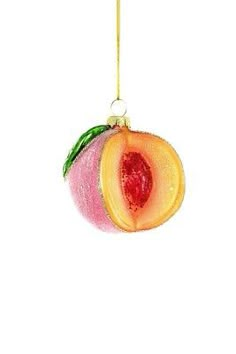 an ornament shaped like a peach hanging from a string on a white background