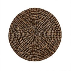 a round woven placemat in brown and black colors on a white background, top view