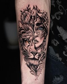 a man's arm with a lion tattoo on it and an arrow in the middle