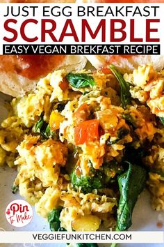 an egg breakfast scramble is shown on a plate with bread and vegetables in the background