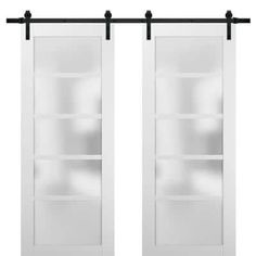 two white sliding doors with black hardware on each side and glass shelves in the middle