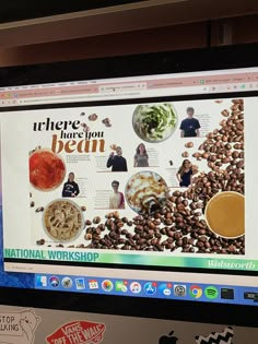 a computer screen with an image of food on it and people in the back ground