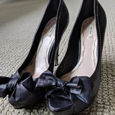 All Reasonable Offers Are Welcome! Beautiful, Playful Peep Toe Miu Miu Black Heels. Leather Bow Covers Top Of Toe Box Area. Pre-Owned Although Signs Of Wear Are Mostly On The Heels Which Have Gotten Dinged Here And There By Sidewalk Grates, Etc. These Could Definitely Be Fixed Up By A Cobbler. The Upper Of The Shoe Is In Excellent Condition. Had Vibram Rubber Soles Put On The Bottom Of The Shoe By Professional Cobbler To Protect The Shoe And Extend It's Life. Its A Very High Heel But It Has A Pl Leather Heels With Bow And Round Toe, Leather Platform Court Shoes For Party, Leather Closed Toe Heels With Bow, Leather Bow Heels For Party, Black Heels With Bow For Night Out, Miu Miu Ankle Strap Heels For Formal Occasions, Leather Almond Toe Heels With Bow, Leather Heels With Bow And Almond Toe, Miu Miu Heels With Sculpted Heel For Evening