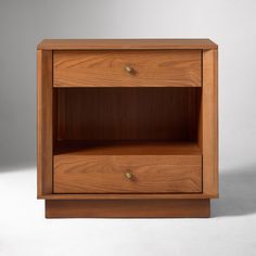 a wooden shelf with two drawers on one side and an open drawer on the other