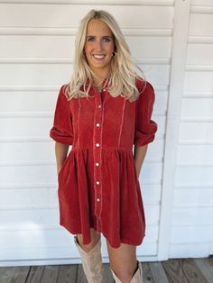 Adorable corduroy red dress with buttons all the way down the front and elastic ends on sleeves. Model is 5'7" with a 28" waist, 34" bust, and 36" hips wearing a small