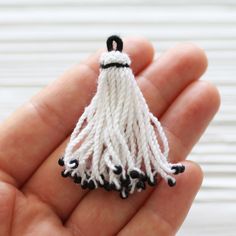 White tassel with black glass beads, earrings tassel, tassel pendant, short white tassel, optic white tassel, necklace tassel, cotton mix,N1 L: 50 mm Please choose the quantity you want! Would you like to see silk tassels? Please check out the link below: https://www.etsy.com/shop/EastVillageSupply?ref=hdr_shop_menu%C2%A7ion_id%C2%A7ion_id&search_query=silk+tassel Would you like to see more ivory/white jewelry findings? Just click the link below: https://www.etsy.com/shop/EastVillageSupply?r White Fringe Tassel Earrings As Gift, White Tassel Earrings Gift, Gift White Tassel Earrings, Handmade White Tassel Necklace As Gift, Handmade White Tassel Necklace For Gift, Silk Tassels, White Tassel, Beads Earrings, Sari Silk