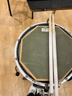 an overhead view of a drum set on a hard wood floor