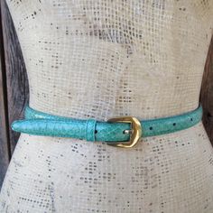 1990s or maybe 1980s blue-green/teal genuine snakeskin belt with gold tone buckle. Made in Taiwan for CHARTER CLUB. Label size M Please compare hole placement to a belt that fits you well Holes at 26 to 29.5" mark, measured from prong to first and last hole Width is 5/8" Good vintage condition with minimal signs of use and age such as a few subtle scuffs to buckle Green Aqua, Suspender Belt, Charter Club, Aqua Green, Belt Size, Suspenders, Waist Belt, Python, Snake Skin