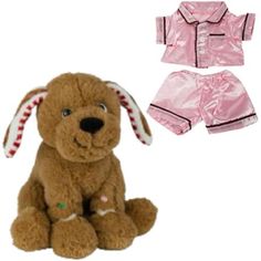 a stuffed dog sitting next to a pink outfit