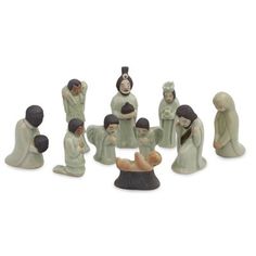 a group of ceramic figurines sitting next to each other