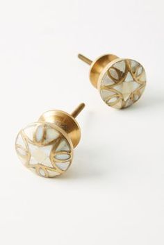 pair of gold and mother of pearl earrings