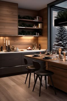 a kitchen with wooden cabinets and counter tops next to a large window overlooking the snow covered trees