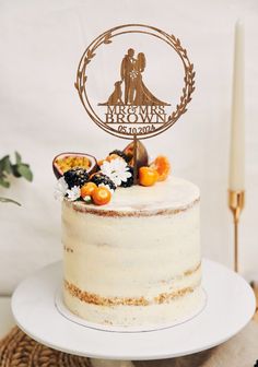 a wedding cake with the bride and groom on top